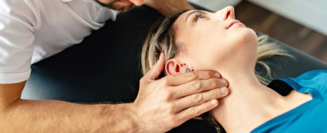 chiropractor working on a patient's neck