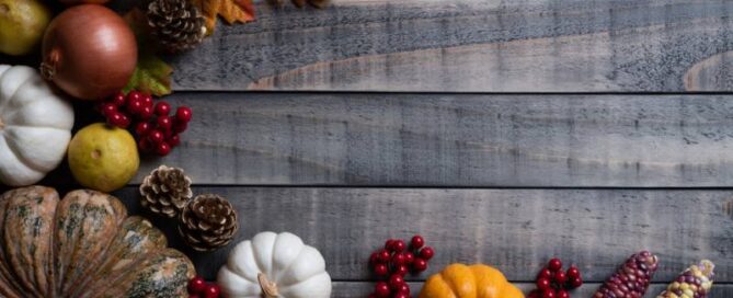 colorful autumn arrangement with pumpkin, corn and leaves