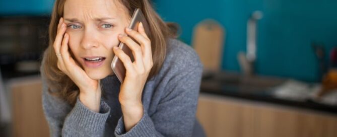 Concerned woman on a phone call at home