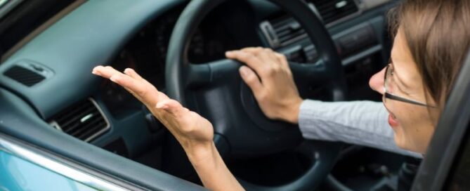 Angry woman in her car after an accident