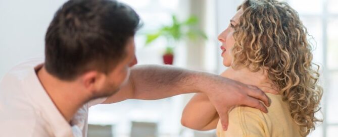 Chiropractor working on a woman's neck pain